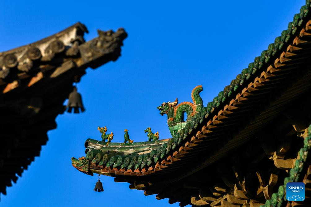 A glimpse of auspicious creatures on rooftops of ancient architecture in China's Shanxi
