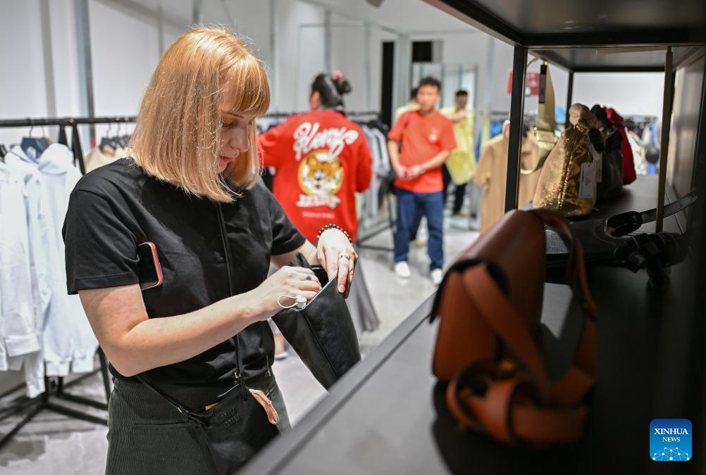 Customers shop at duty-free shopping mall in Sanya, China's Hainan