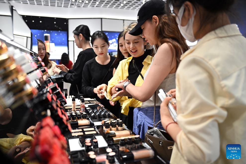 Customers shop at duty-free shopping mall in Sanya, China's Hainan