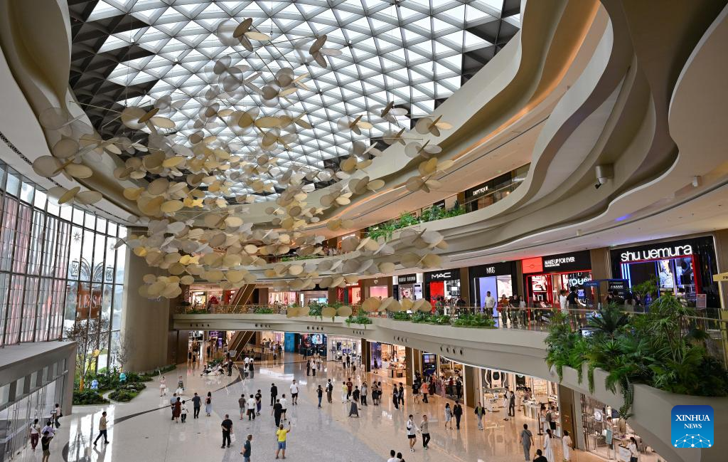 Customers shop at duty-free shopping mall in Sanya, China's Hainan