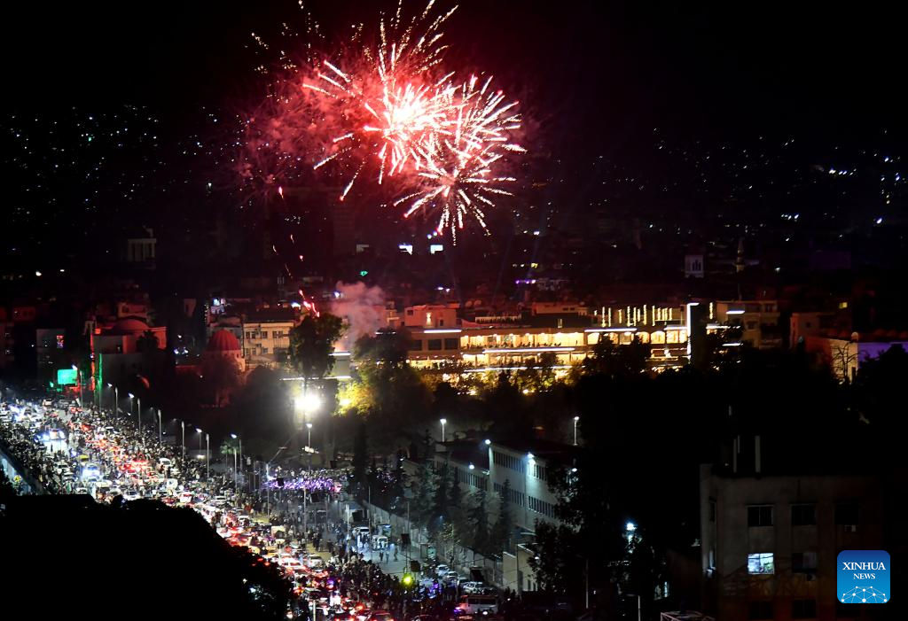 Syria's interim authorities mark first year of political transition with military parade