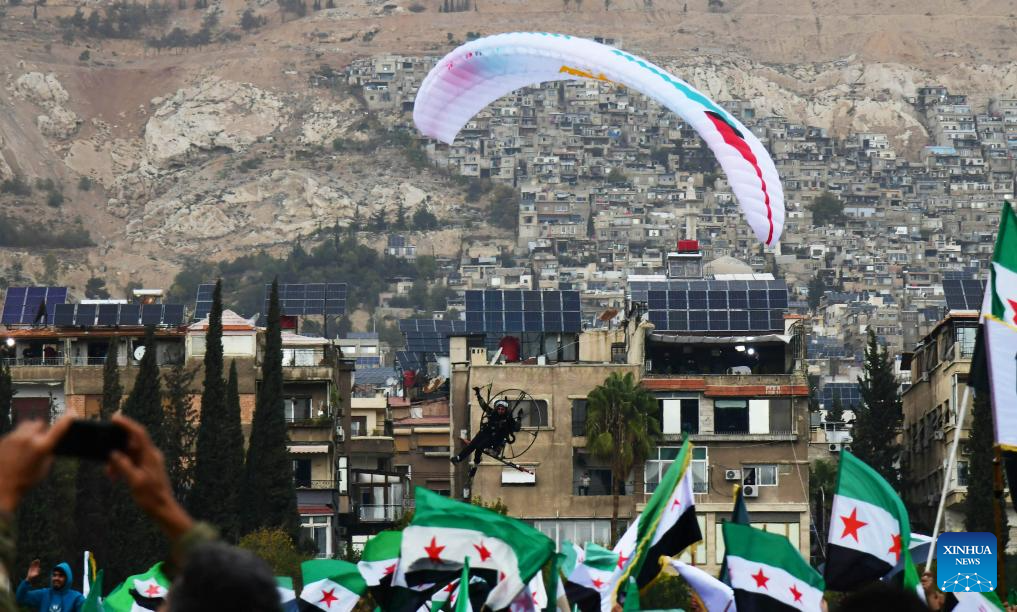 Syria's interim authorities mark first year of political transition with military parade