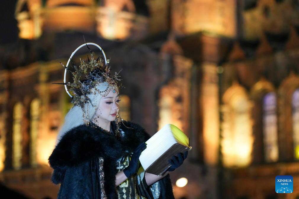 Tourists take travel photos at square of architecture art in Harbin