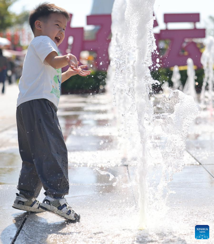 People enjoy leisure time in China's Hainan