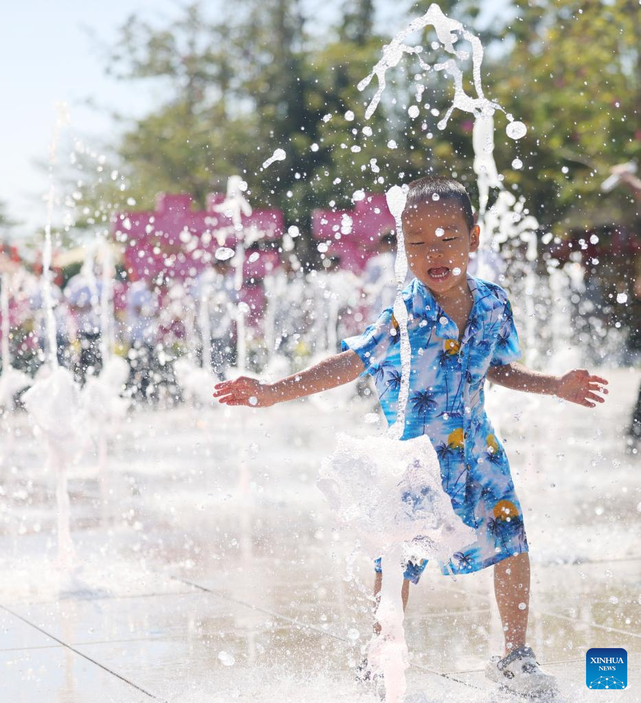 People enjoy leisure time in China's Hainan