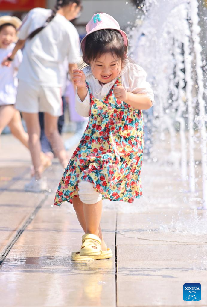 People enjoy leisure time in China's Hainan