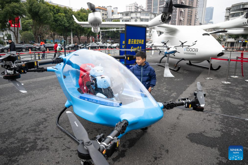 Electric vertical takeoff and landing aircraft, humanoid robots make debut in Wuhan, China's Hubei