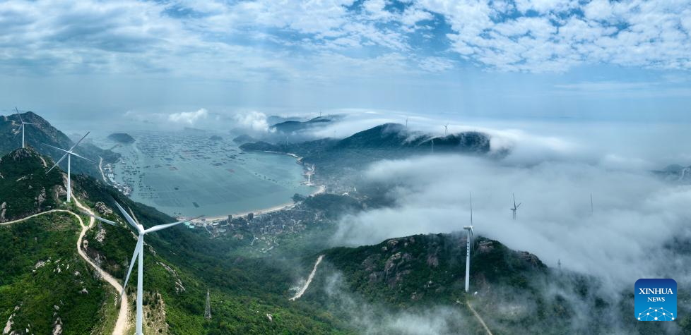 Aerial view of wind farm shrouded in fog in Lianjiang, China's Fujian