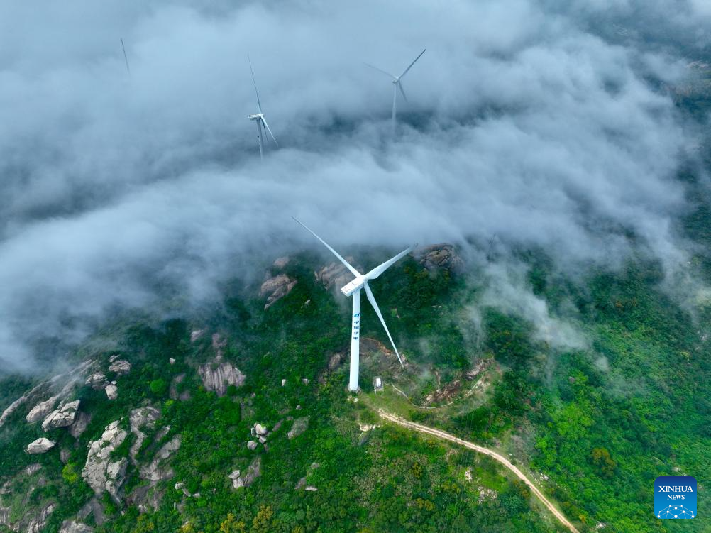 Aerial view of wind farm shrouded in fog in Lianjiang, China's Fujian