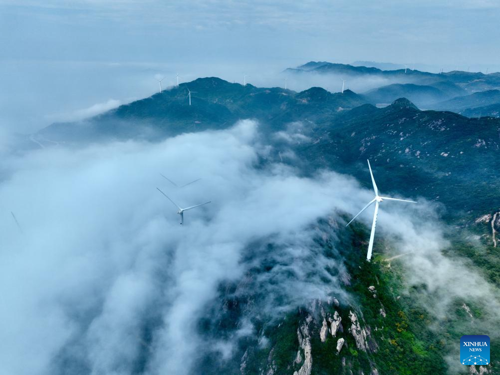 Aerial view of wind farm shrouded in fog in Lianjiang, China's Fujian