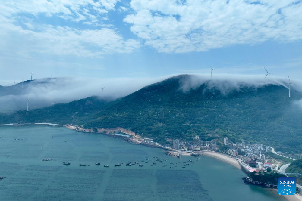 Aerial view of wind farm shrouded in fog in Lianjiang, China's Fujian