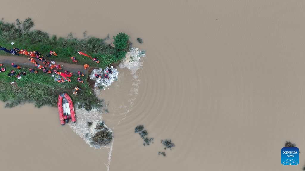 Thousands evacuated as heavy rain swells rivers in central China