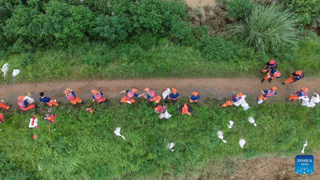 Thousands evacuated as heavy rain swells rivers in central China