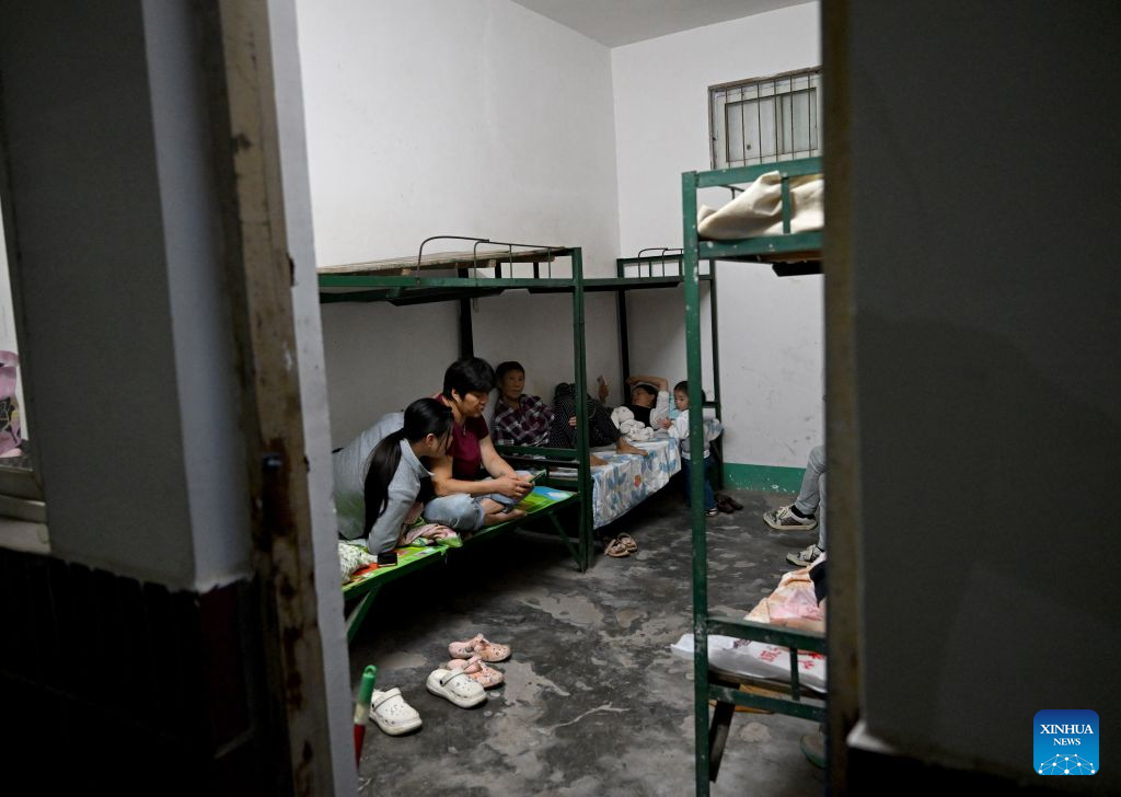 Thousands evacuated as heavy rain swells rivers in central China