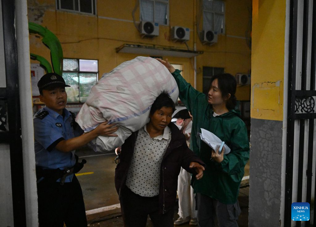 Thousands evacuated as heavy rain swells rivers in central China