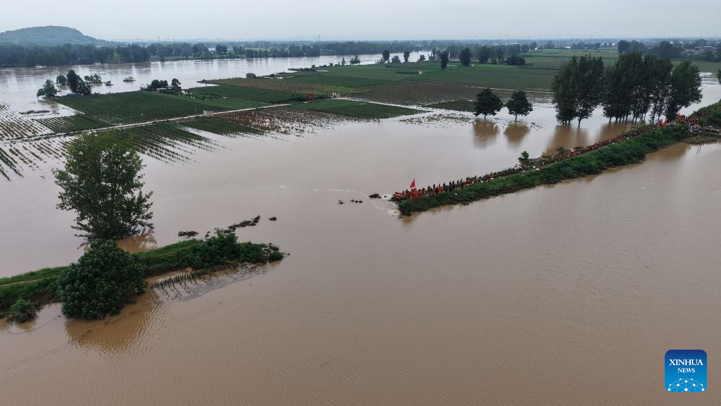 Thousands evacuated as heavy rain swells rivers in central China
