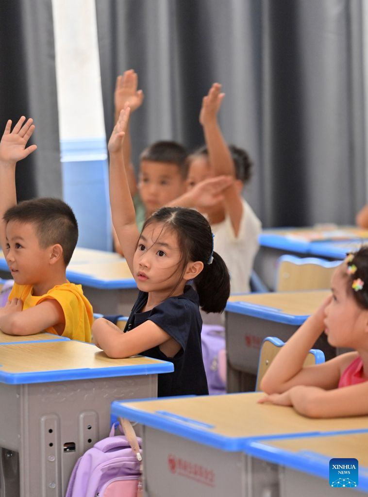 Primary and secondary schools in parts of China welcome first day of new semester