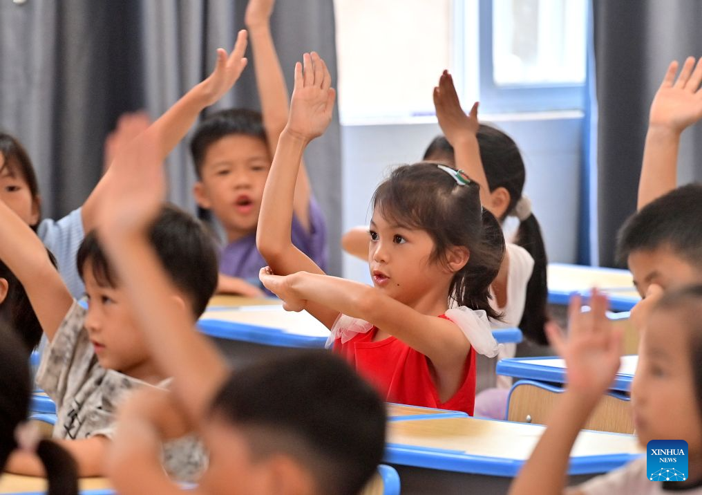Primary and secondary schools in parts of China welcome first day of new semester