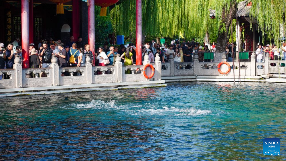 People visit Baotu Spring in Jinan, E China