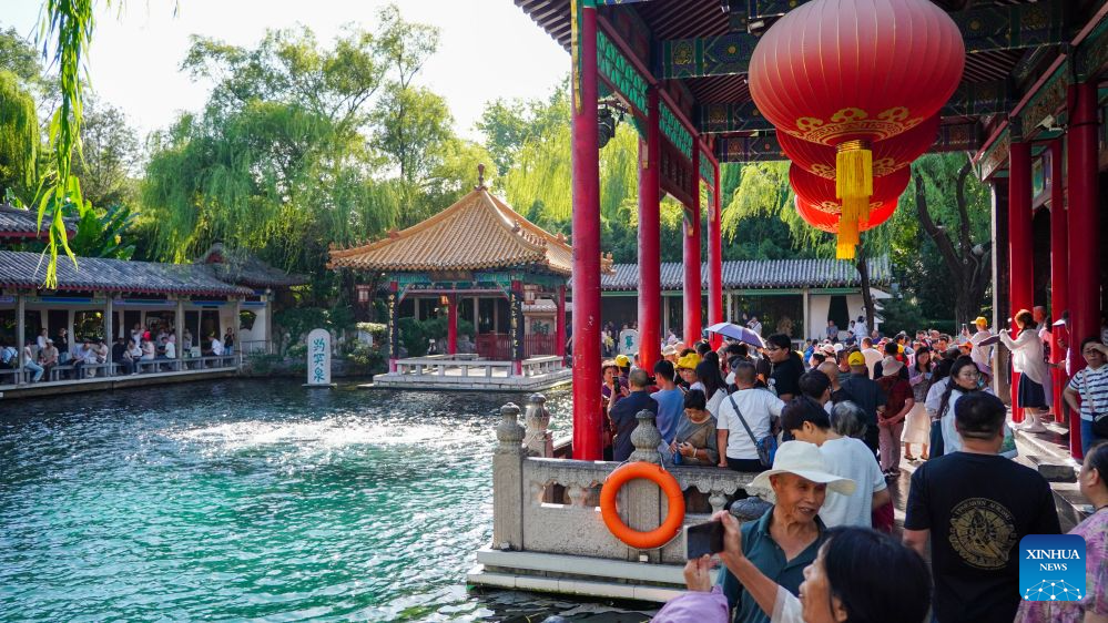 People visit Baotu Spring in Jinan, E China