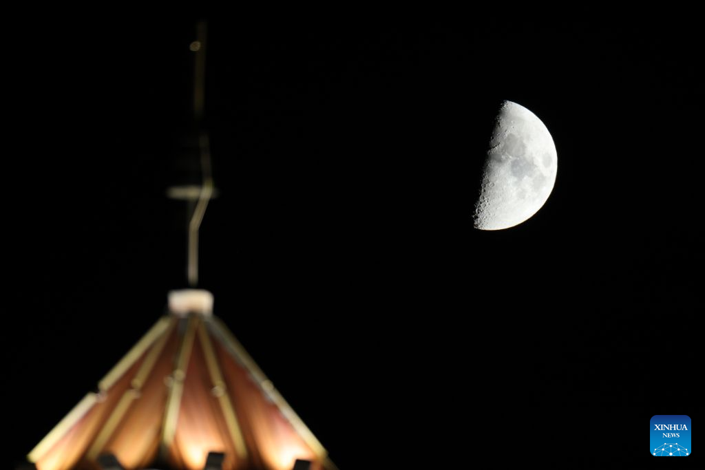 View of first quarter moon across China