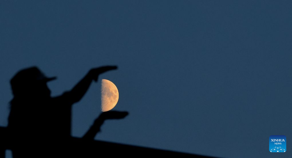 View of first quarter moon across China