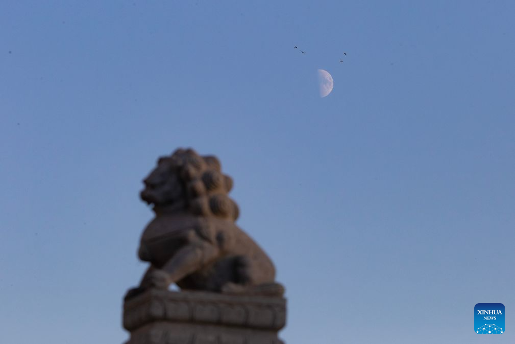 View of first quarter moon across China