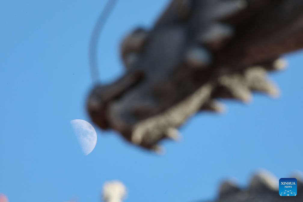 View of first quarter moon across China