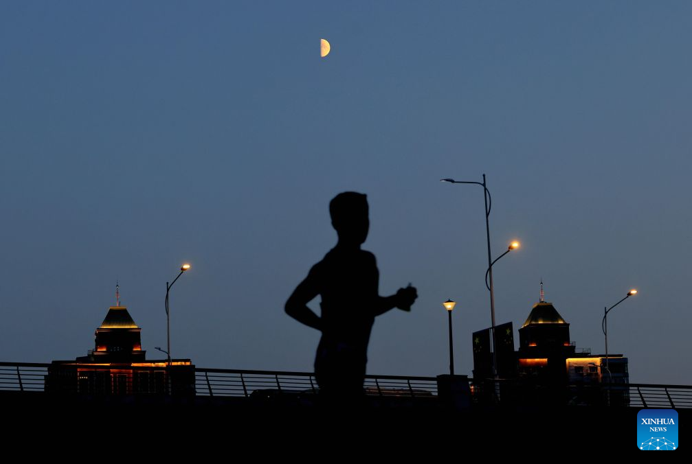 View of first quarter moon across China